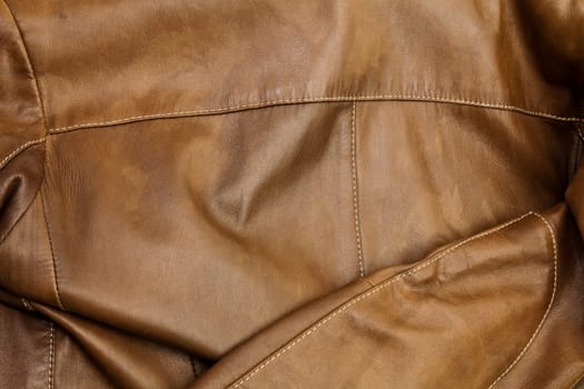Detail of light brown leather clothing with a distinctive color and texture