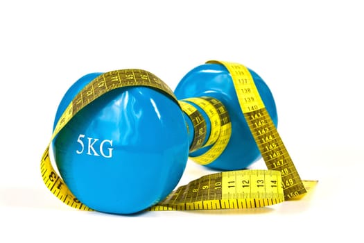 Gymnastics dumbbell and tape measure on a white background