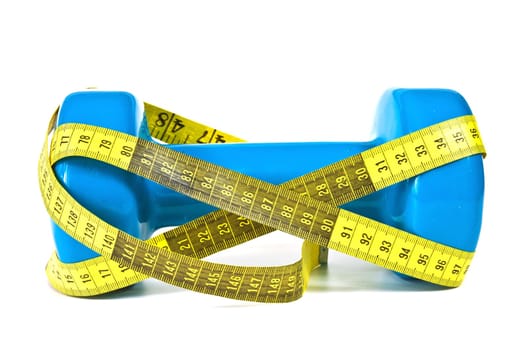 Gymnastics dumbbell and tape measure on a white background
