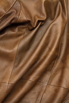Detail of light brown leather clothing with a distinctive color and texture