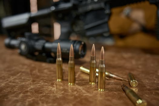 Automatic rifle and bullets at weapon store. Production and sale of firearms for army and police special forces