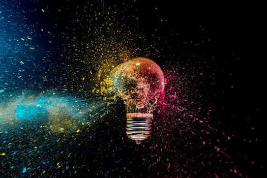 colorful exploding lightbulb powder splash  dark background