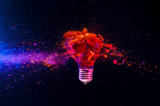 Red light bulb exploding dark background creativity crisis energy