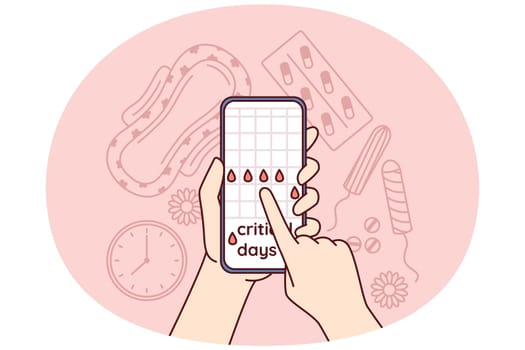 Menstruation cycle calendar in mobile phone in hands near pads and tampons or feminine hygiene products and pain pills. Planning menstruation or critical days using website for girls