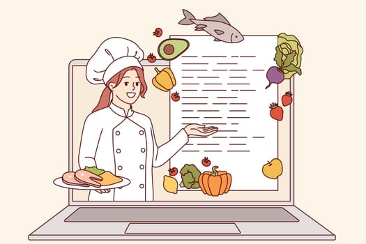 Online cooking course from woman chef looking out of laptop screen and recommending recipe. Culinary webinar is conducted by professional cook, talking about ingredients and methods of cooking dishes