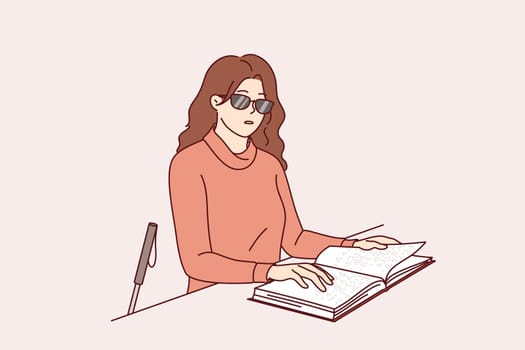 Blind woman reads braille book, using literature for people with disabilities to gain new knowledge. Blind girl in sunglasses touches pages of textbook to recognize three-dimensional letters.