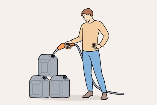 Man pours gasoline into tanks at gas station to stock up on fuel for car in case of oil crisis. Positive guy uses tank cars to store gasoline or kerosene when traveling long distances