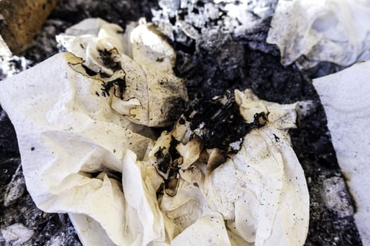 Detail of sheet of paper burned by fire
