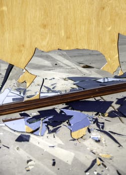 Detail of broken glass thrown in the trash, crime