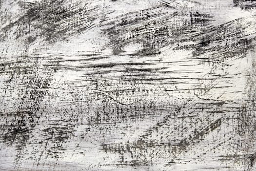 Detail of scratched and damaged white wall, ruin and crime