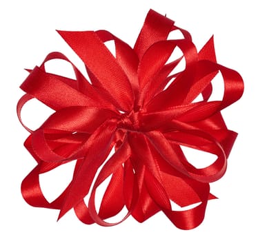 Knotted yellow silk ribbon in a bow on an isolated background, top view