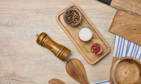 White salt, peppercorns on the table, top view. Spice