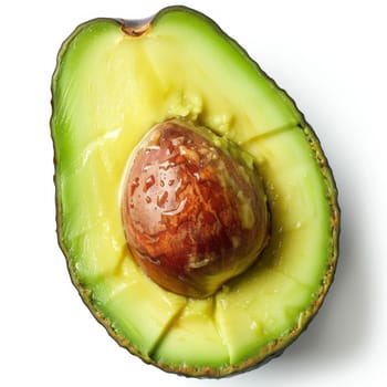 A close-up of a fresh, ripe avocado half with pit on a white background