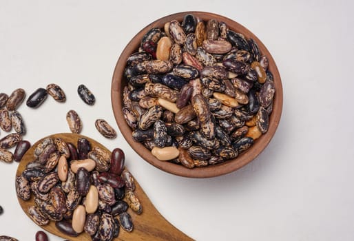 Raw red beans in a plate on the table, top view.