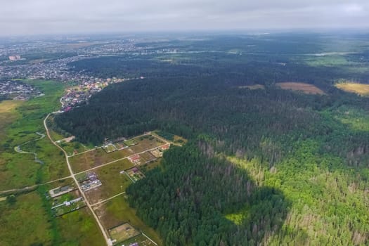 Top view of the village, fields and forests near the village