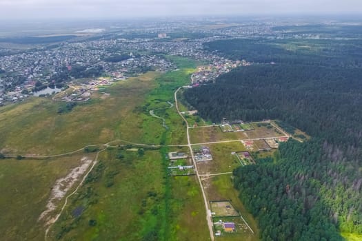 Top view of the village, fields and forests near the village