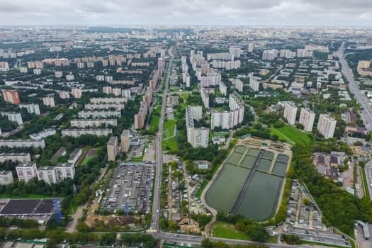 Top view of the city of Moscow, buildings and roads and other infrastructure of the city. Cityscape view from above.