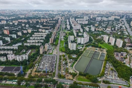 Top view of the city of Moscow, buildings and roads and other infrastructure of the city. Cityscape view from above.