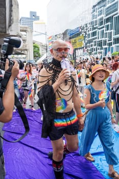 Bangkok, Thailand - JUN 1, 2024 Bangkok Pride Festival 2024, The short action and atmosphere of people joins celebrations in the event in Siam Square Bangkok, Thailand. Gender diversity There is no division of age, race or religion.