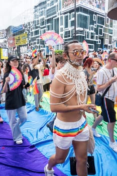 Bangkok, Thailand - JUN 1, 2024 Bangkok Pride Festival 2024, The short action and atmosphere of people joins celebrations in the event in Siam Square Bangkok, Thailand. Gender diversity There is no division of age, race or religion.