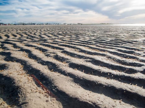 Flat wide-angle view over the dried out and wavy mudflats in East Frisia near Bensersiel.
