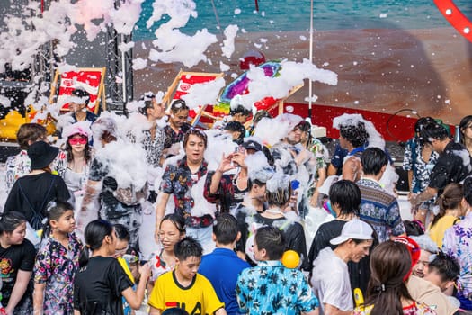 Siam Square, Bangkok, Thailand - APR 13, 2024 Songkran Festival, The short action of people joins celebrations of the Thai New Year or Songkran in Siam Square Bangkok, Thailand.