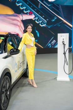 Nonthaburi, Thailand - APR 2, 2023 Unidentified model poses with a car at The 44th Bangkok international motor show 2023 at IMPACT Arena, Muang Thong Thani, Nonthaburi, Thailand.