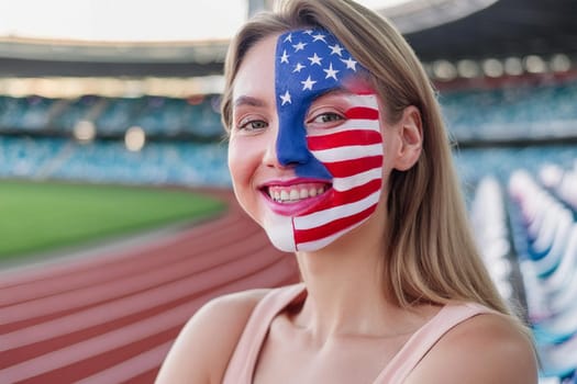A woman with a face painted in the colors of the American flag smiles happily at a sports stadium.