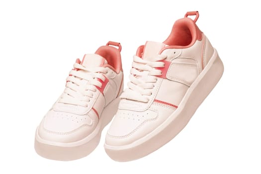 White sneaker isolated. Close-up of a pair white elegant stylish female leather high-heeled sport shoes isolated. Womens shoe fashion. Modern footwear for workout.