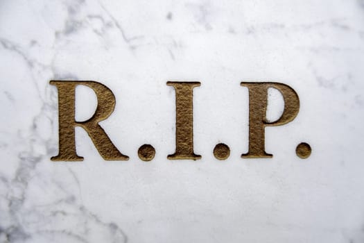 Detail of inscription on an old grave in a cemetery