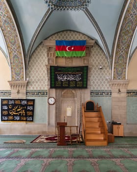 Interior of the Icherisheher Juma mosque in the Old Town, Baku, Azerbaijan, showcasing beautiful traditional design with arched ceiling and detailed decorations