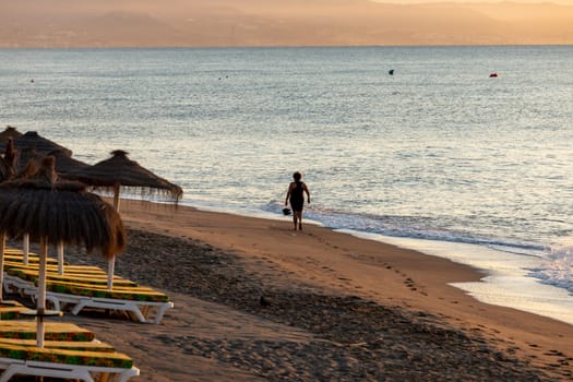 View of Bajondillo Beach in Torremolinos at sunrise. Costa del Sol, Spain.