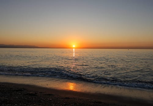 Sunrise over the Mediterranean Sea seen from the beach in Torremolinos. Costa del Sol, Spain