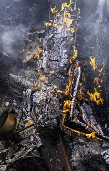 Detail of wood burning with fire and flames, destruction