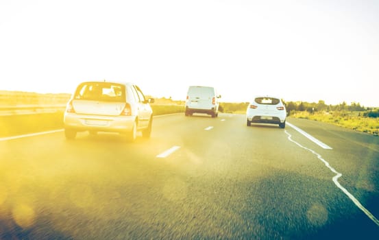 On blur traffic road with colorful bokeh light abstract background. Real traditionnal photography