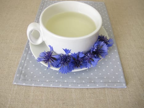 Herbal tea with petals from the blue cornflower flower