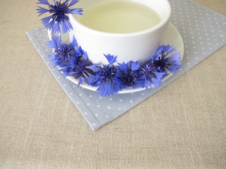 Herbal tea with petals from the blue cornflower flower