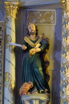 Saint Mark the Evangelist, statue on High altar in the Parish Church of Exaltation of the Holy Cross in Kriz, Croatia
