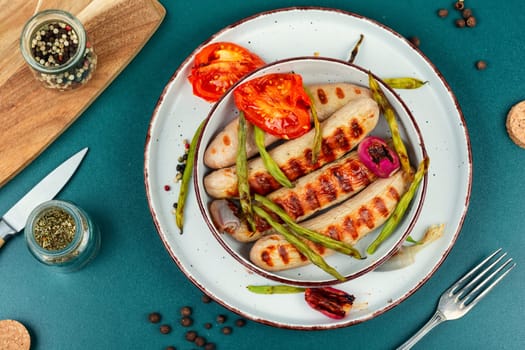 Pork barbecue sausages BBQ. German grilled sausages. Bratwurst.