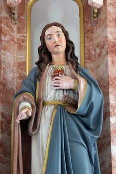 Immaculate heart of Mary, statue on the High altar in the parish church of Saint Luke in Lukac, Croatia