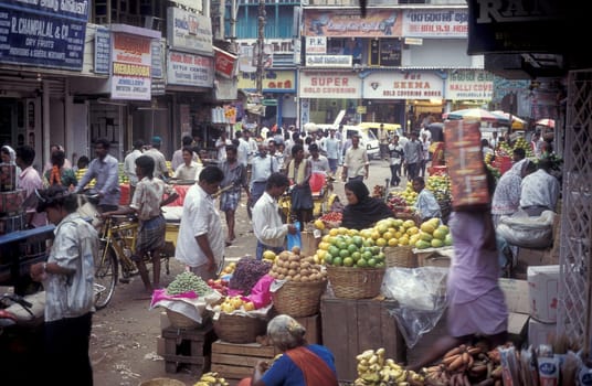 People at a Streetmarket and alley in the city of Chennai in Province Tamil Nadu in India.  India, Chennai, April, 1998