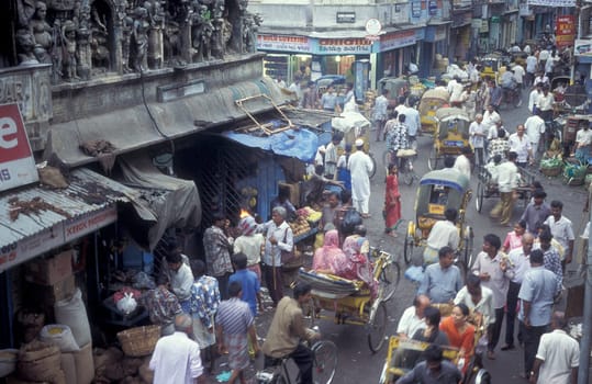 Traffic and pollution with cars, bus amd motorcycle on a mainroad in the city of Chennai in Province Tamil Nadu in India.  India, Chennai, April, 1998