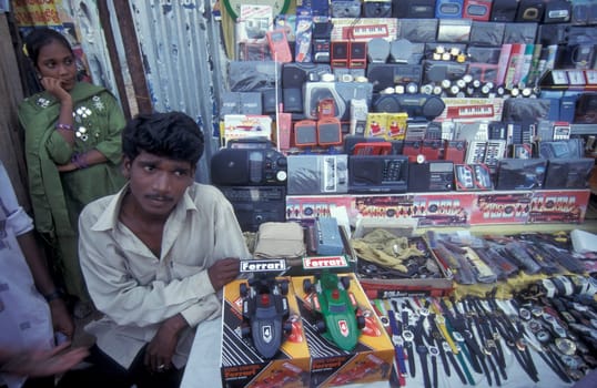 a family in a shop at a marketstreet in the city of Chennai in Province Tamil Nadu in India.  India, Chennai, April, 1998