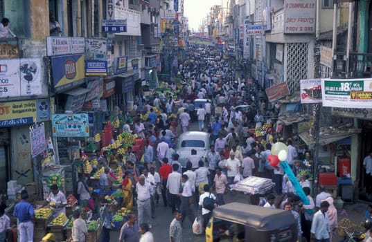 Traffic and pollution with cars, bus amd motorcycle on a mainroad in the city of Chennai in Province Tamil Nadu in India.  India, Chennai, April, 1998