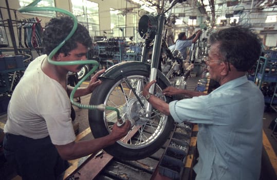 Worker at the Motorcycle Factory of Royal Enfield in of Chennai in the Province Tamil Nadu in India.  India, Chennai, April, 1998