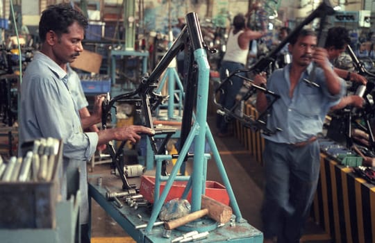 Worker at the Motorcycle Factory of Royal Enfield in of Chennai in the Province Tamil Nadu in India.  India, Chennai, April, 1998
