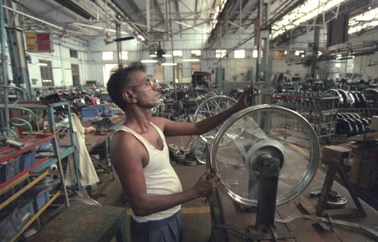 Worker at the Motorcycle Factory of Royal Enfield in of Chennai in the Province Tamil Nadu in India.  India, Chennai, April, 1998