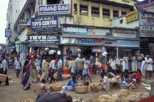 People at Streetmarket and alley in the city of Chennai in Province Tamil Nadu in India.  India, Chennai, April, 1998