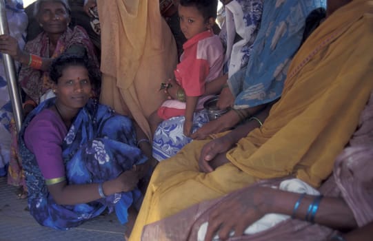 Indian women in a public bus in the city of Chennai in Province Tamil Nadu in India.  India, Chennai, April, 1998
