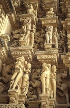 Erotic Sculptures at the erotic Temple or Hindu Temple of Kandarija Mahadeva Temple in the city of Khajurao in Province Madhya Pradesh in India.  India, Khajurao, April, 1998